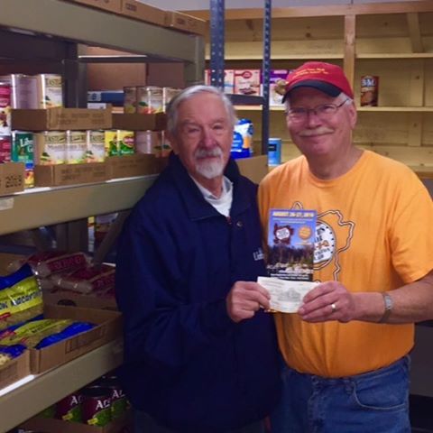 Washington Island Food Pantry, John Davies accepting $1000 donation from Dick Jepsen Death's Door BBQ